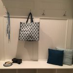 Mud room staged with accessories.